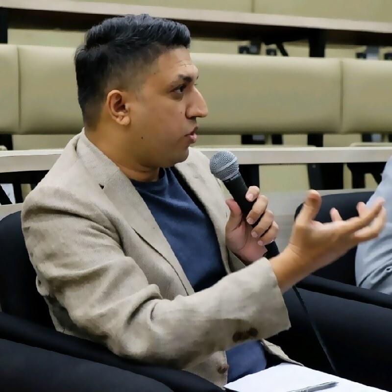 Hamdan Akram speaking at a training session